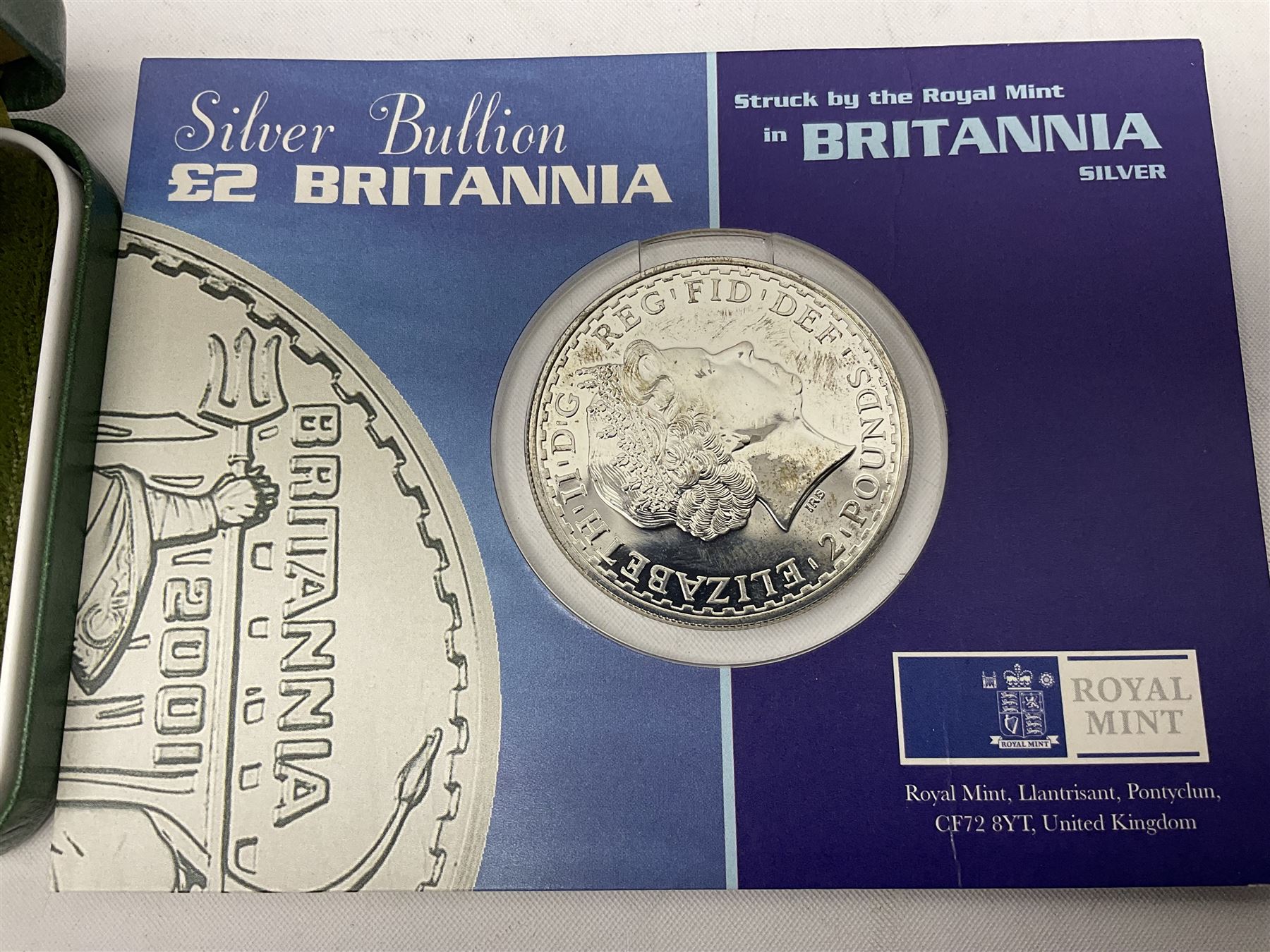 Seven The Royal Mint United Kingdom sterling silver proof crown coins, comprising two 1972, three 1977, 1981 and 1993, all cased with certificates and a Queen Elizabeth II 2001 one ounce fine silver Britannia coin on card (8)