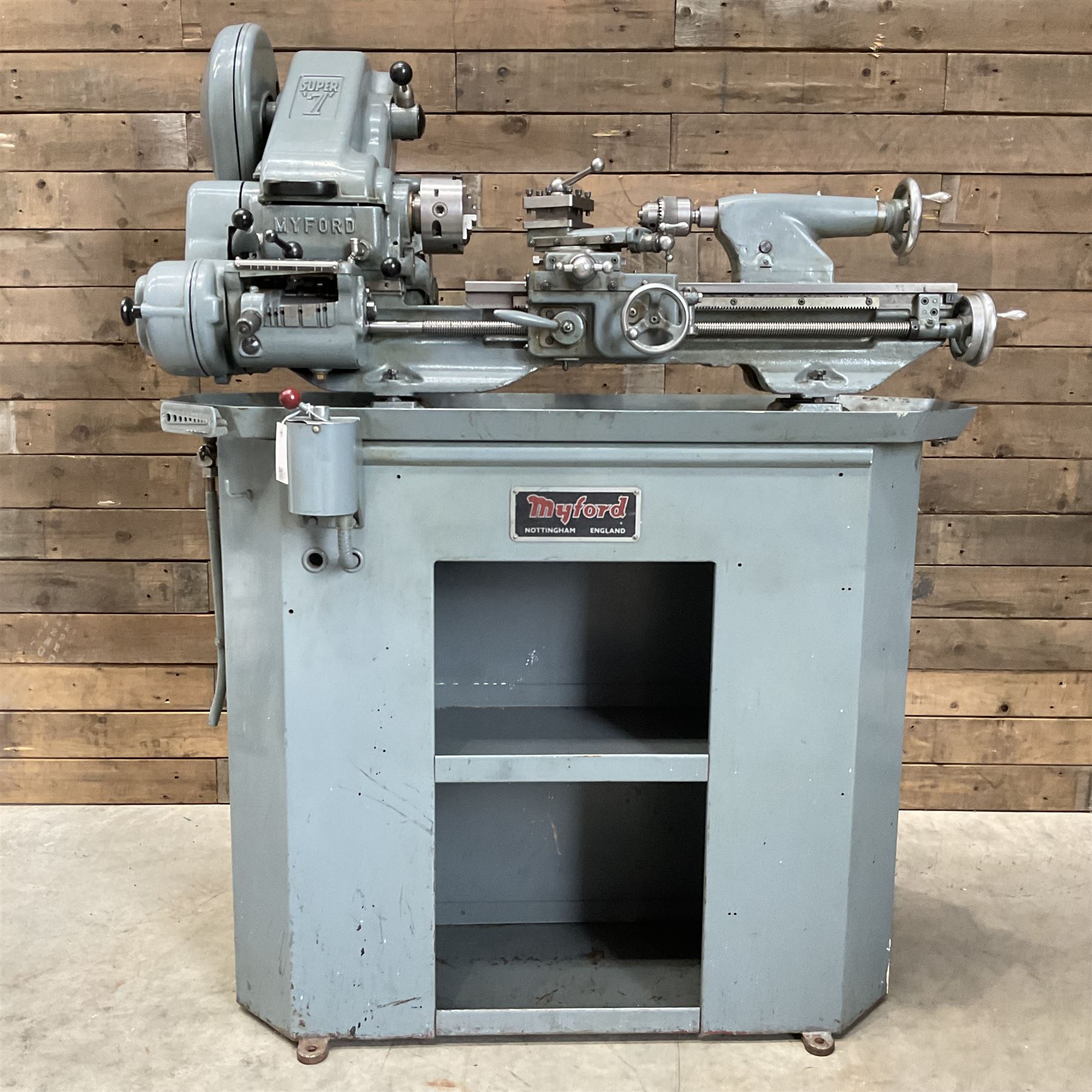 Myford Super 7 metal turning lathe with extensive collection of attachments, chucks, collets, bits; and precision metal saw