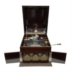 Early 20th century wind up gramophone set in a wooden case with twin door sound hole to the front and tins of 'His Masters Voice' needles