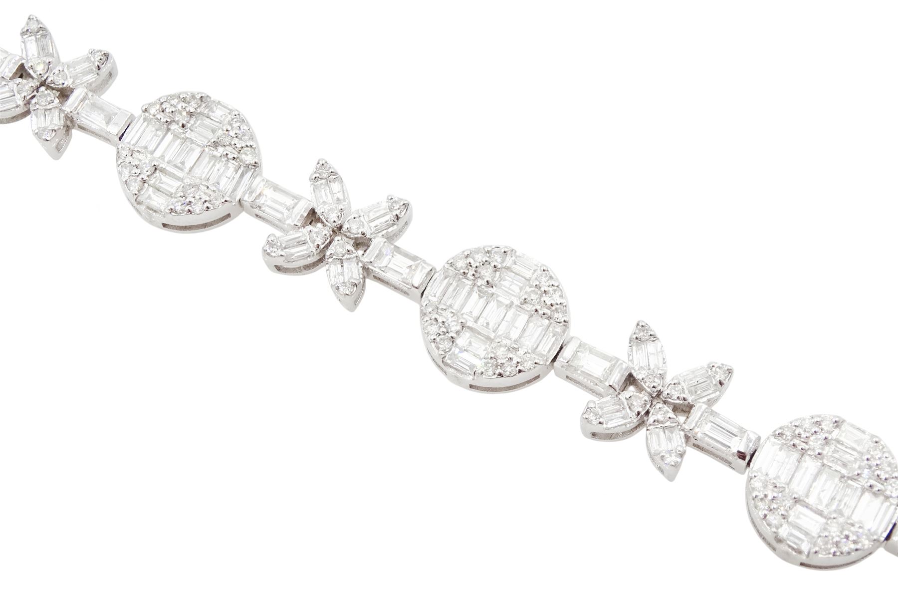 18ct white gold diamond bracelet, eight circular, pave set round brilliant cut and baguette cut diamond clusters, spaced by a single baguette cut diamond and a diamond flower head design cluster, stamped 750, total diamond weight approx 3.70 carat