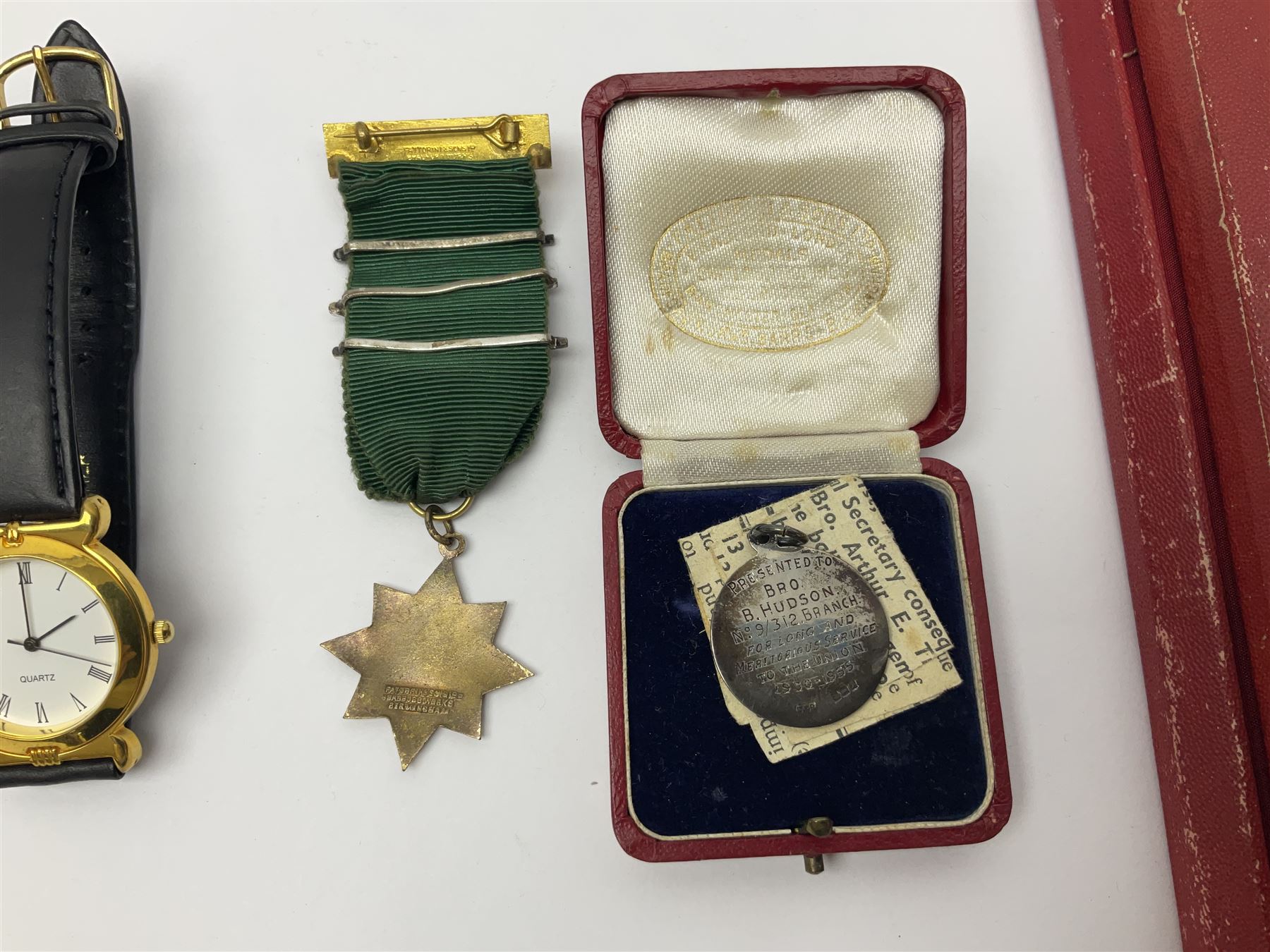 Ladies Accurist 9ct gold manual wind wristwatch, on gilt metal bracelet, together with a silver and enamel fob, for the Transport and General Workers Union, with personal engraving to reverse, hallmarked, a safe driving medal and a Quartz wristwatch