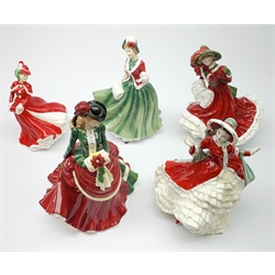 A group of five Royal Doulton figures, comprising Christmas Day 2000 HN4242, Christmas Day 2005 HN4723, Pretty Ladies Winter Elegance HN5109, Victorian Christmas N4675, and Christmas Celebration HN4721, four with boxes. (5). 