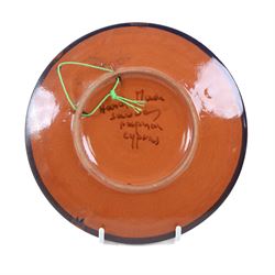 Large mid-20th century Spanish Puigdemont studio pottery charger, depicting a stylised fish, together with three other plates decorated with fish 