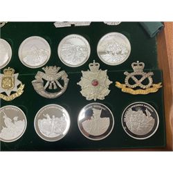 Great British Regiments, 1977, set of fifty two frosted silver medals by the Birmingham Mint, each bearing the name of a regiment with a depiction of an action on the obverse and further details on the reverse, all hallmarked Birmingham Mint, assay offices and dates; together with 52 base metal copy cap badges for each regiment, all housed and mounted on two trays and contained within a wooden presentation case, with brass plaque and fittings, lock and key, with a certificate of authenticity 