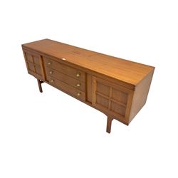 Elliotts of Newbury (EoN) - mid-20th century teak sideboard, fitted with three central drawers flanked by two cupboards, raised on square supports 