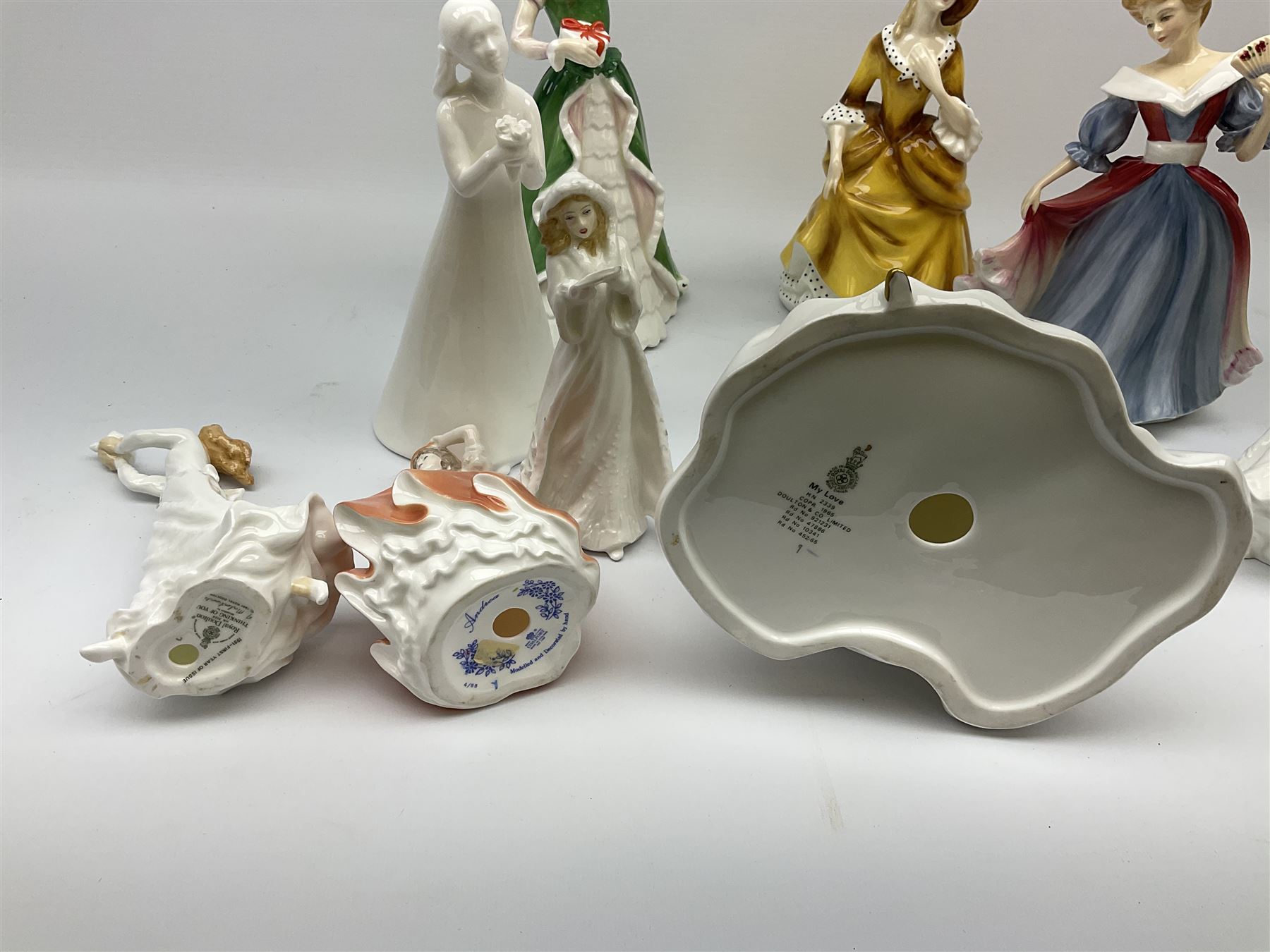 Nine figures; eight Royal Doulton, , Amy, Sandra, thank you, thinking of you, Christmas carols, my love, happy birthday, Merry Christmas and one Coalport figures, Andrea 
