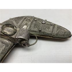 Omani Khanjar dagger, the 12.5cm curved blade with pronounced medial rib to either side, waisted horn style hilt with dome shaped pommel and inlaid pique work; in an intricately filigree decorated white metal scabbard with rings woven into the belt mount L25cm overall