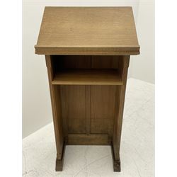 'Mouseman' oak lectern, sloped reading stand on panelled front, fitted with single shelf, sledge feet, by Robert Thompson of Kilburn