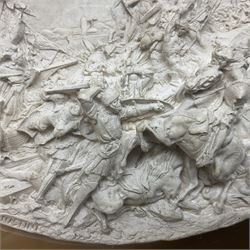 Justin Mathieu, two oval high relief plaque depicting a battle scenes, each within a wooden frame, frame  H21cm, L25cm