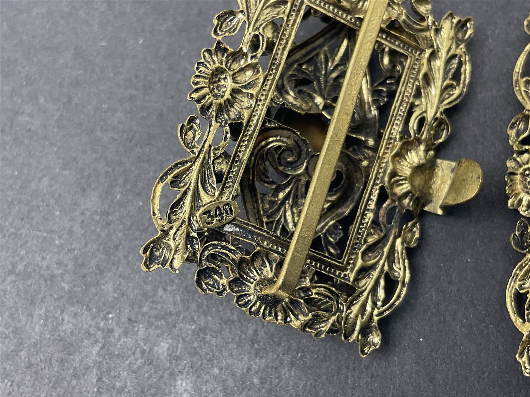 9ct gold jewellery including leaf brooch, wishbone Mizpah brooch, carnelian brooch, gold cased ladies Omega wristwatch, on leather strap and gold cased ladies Tissot wristwatch on expanding gilt strap, together with silver brooches and a Czech paste buckle, etc