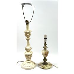 A cream painted wooden table lamp, together with an onyx and gilt table lamp, plus two fabric shades. 