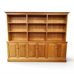Philip Koomen (1953-) - Craftsman-made modern cherrywood large open
bookcase with a cupbo...