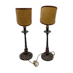Pair of Continental mahogany lamps of fluted column form, not including half shades approximately H238cm