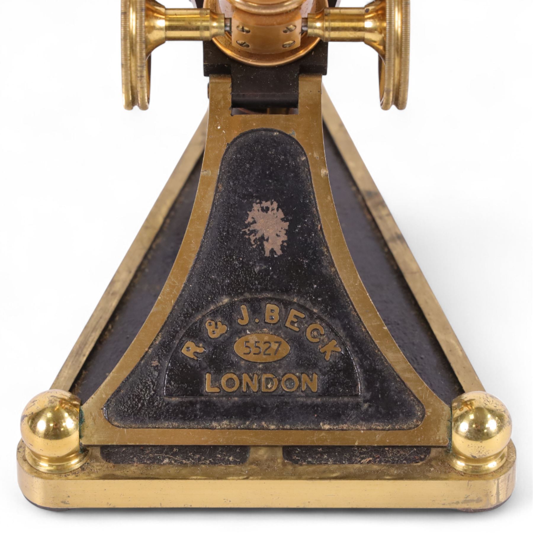 19th century brass binocular microscope by R&J Beck, London, numbered 5527, with rack and pinion focusing, with four eye pieces and three objective lenses, in wooden case