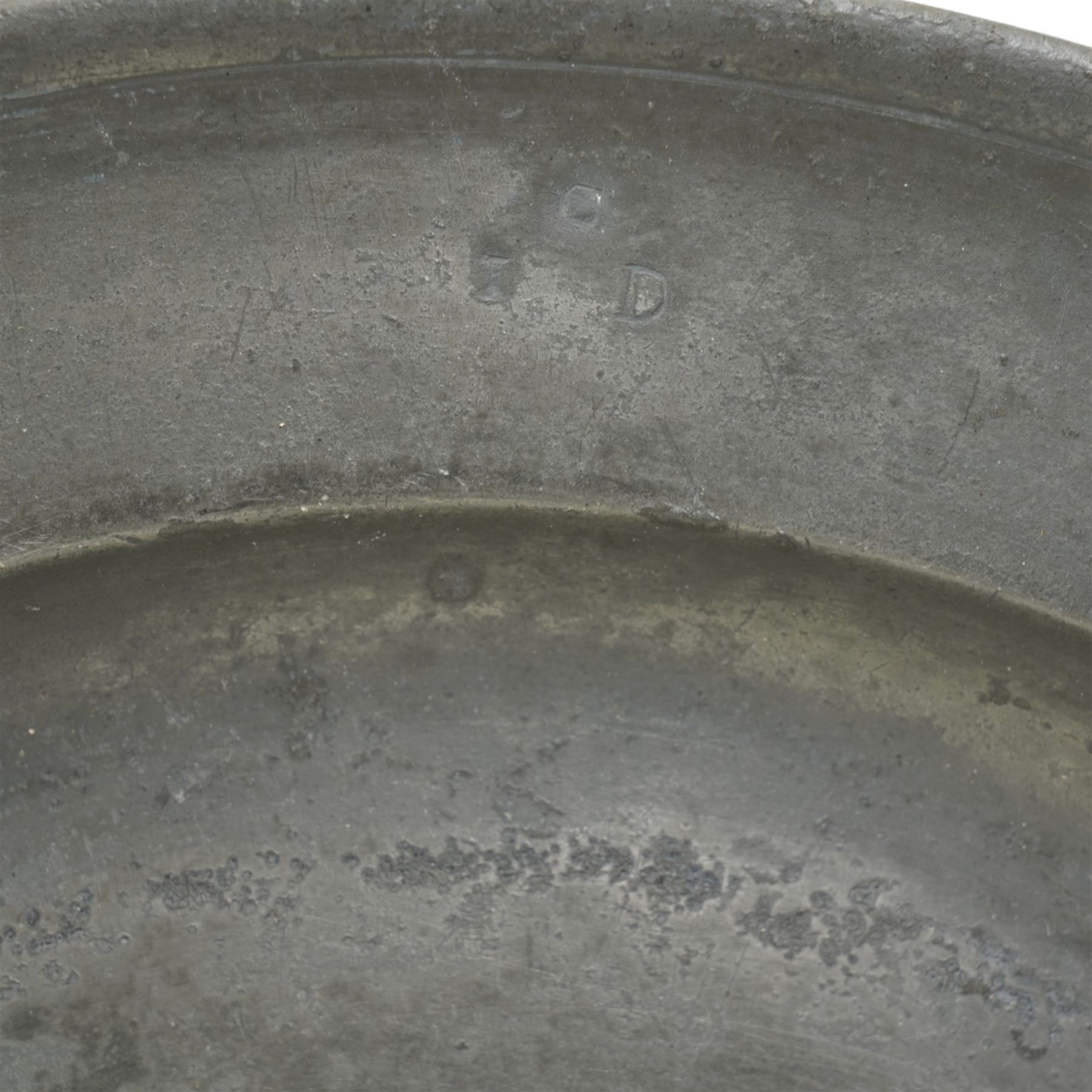 Collection of early 19th century and later British pewter, mostly London label marks, including two large pewter chargers, medicine spoon, flasks, plates and other tableware