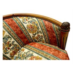 Pair of cherry wood framed tub-shaped armchairs, upholstered in striped floral fabric with brass stud trim, carved walnut frame with fluted supports capped with pinecone finials, on turned feet