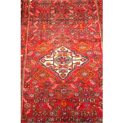  Persian hand knotted red ground wool rug, central medallion, 235cm x 130cm  