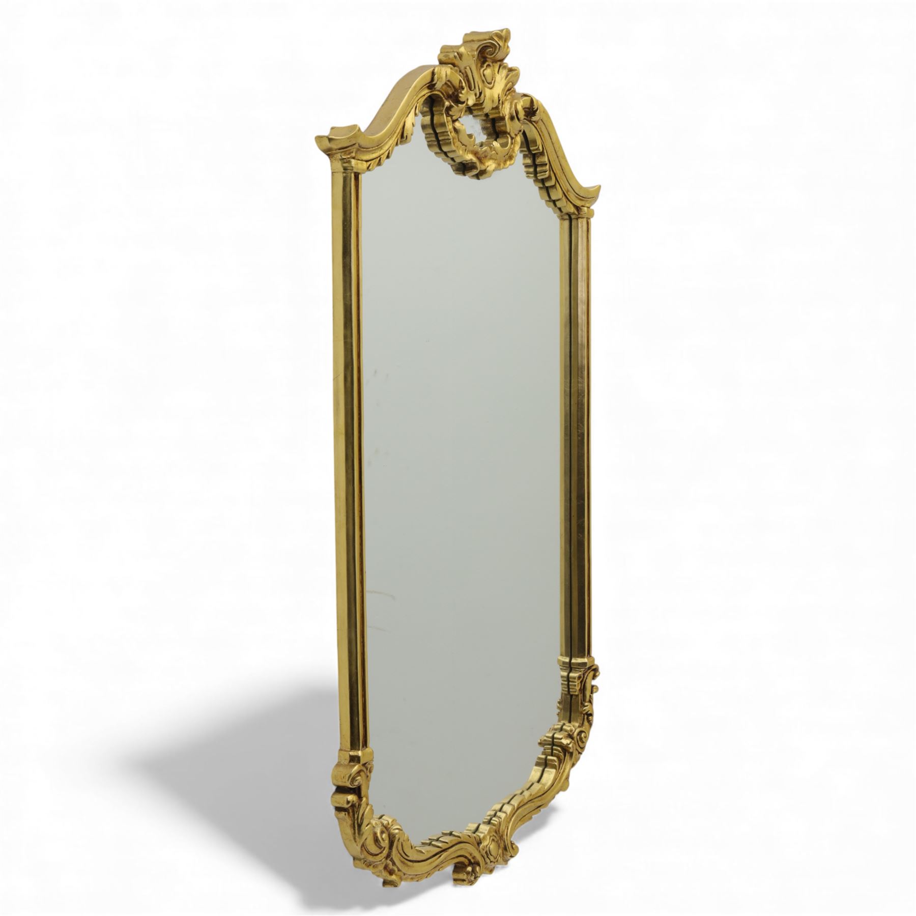 Late 20th century giltwood pier glass in a Rococo style, with rectangular mirror plate bordered by a heavily scrolled frame and foliate cresting