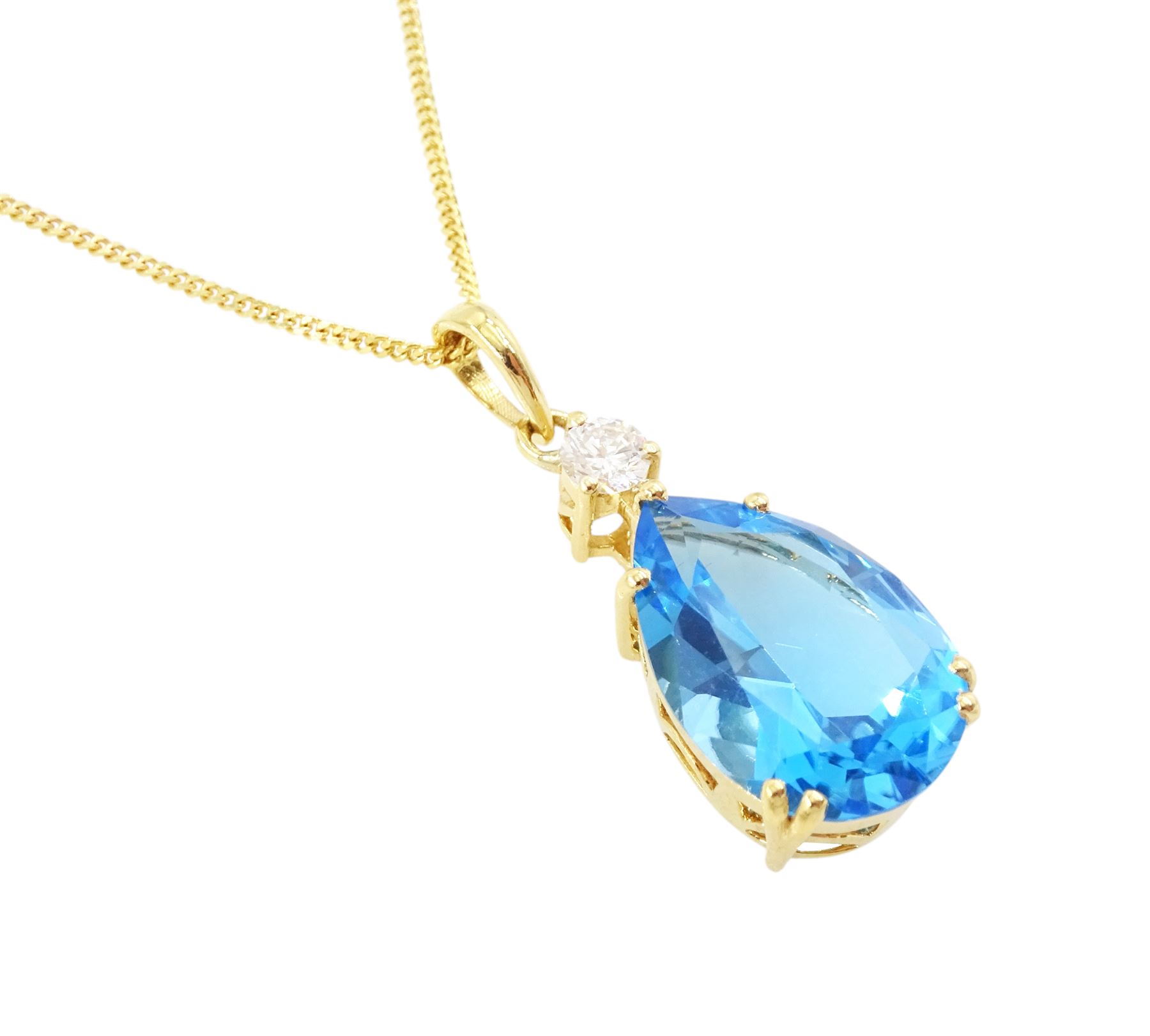 18ct gold blue topaz and diamond pendant necklace, single pear cut Swiss blue topaz of approx 6.60 carat, suspending from a single round brilliant cut diamond of approx 0.15 carat
