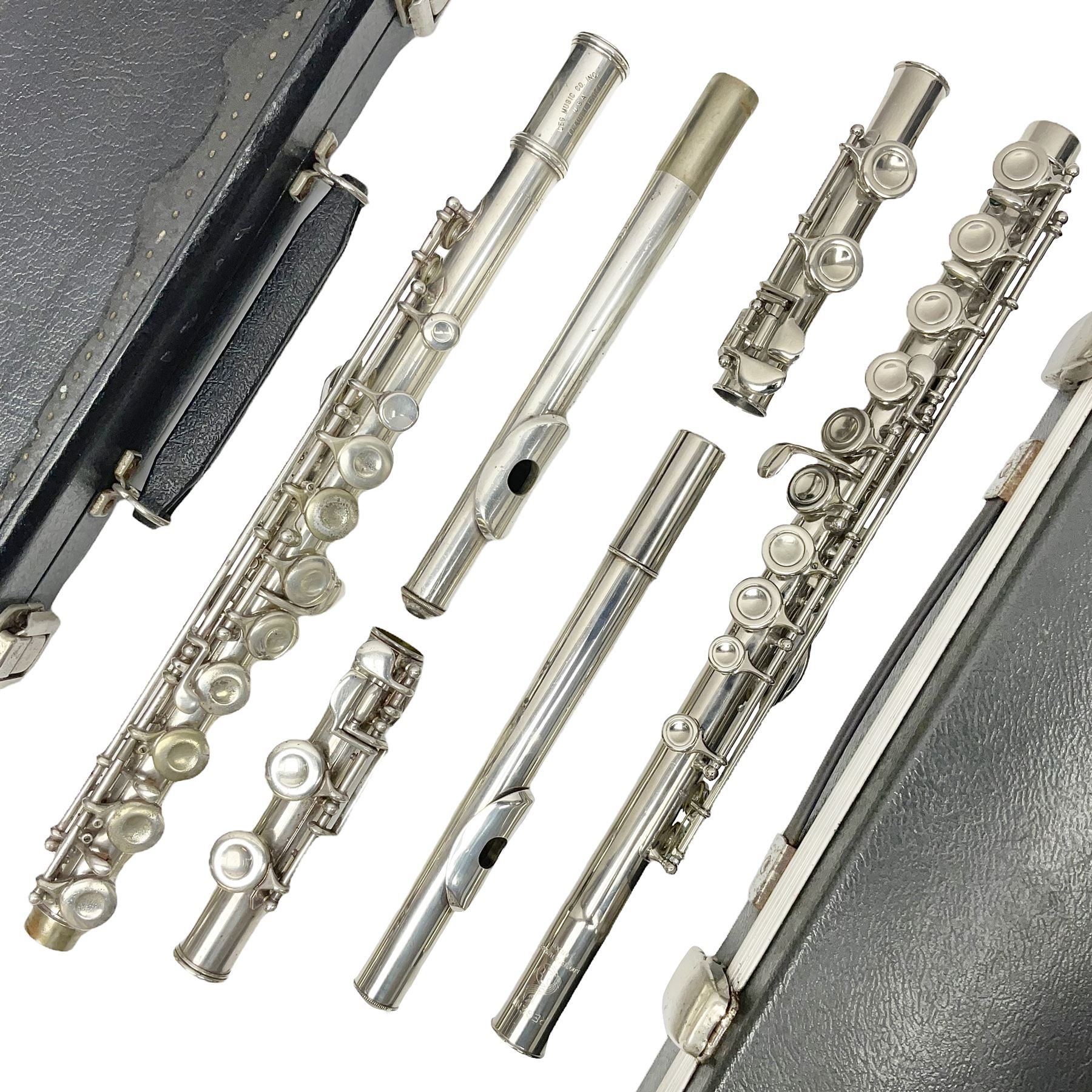 Boosey & Hawkes London Regent three-piece flute, serial no.345447; in B&H Bandhite hard carrying case; and Deg Music Company Inc. USA Claudel Model three-piece flute, serial no.491718, in hard carrying case (2)