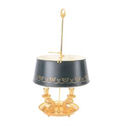 Bouillotte table lamp, designed with two dolphins supporting three faux candle sconces, the adjustable metal shade with arrow fletching form screw, the oval base upon circular pan on four bun feet, H46cm