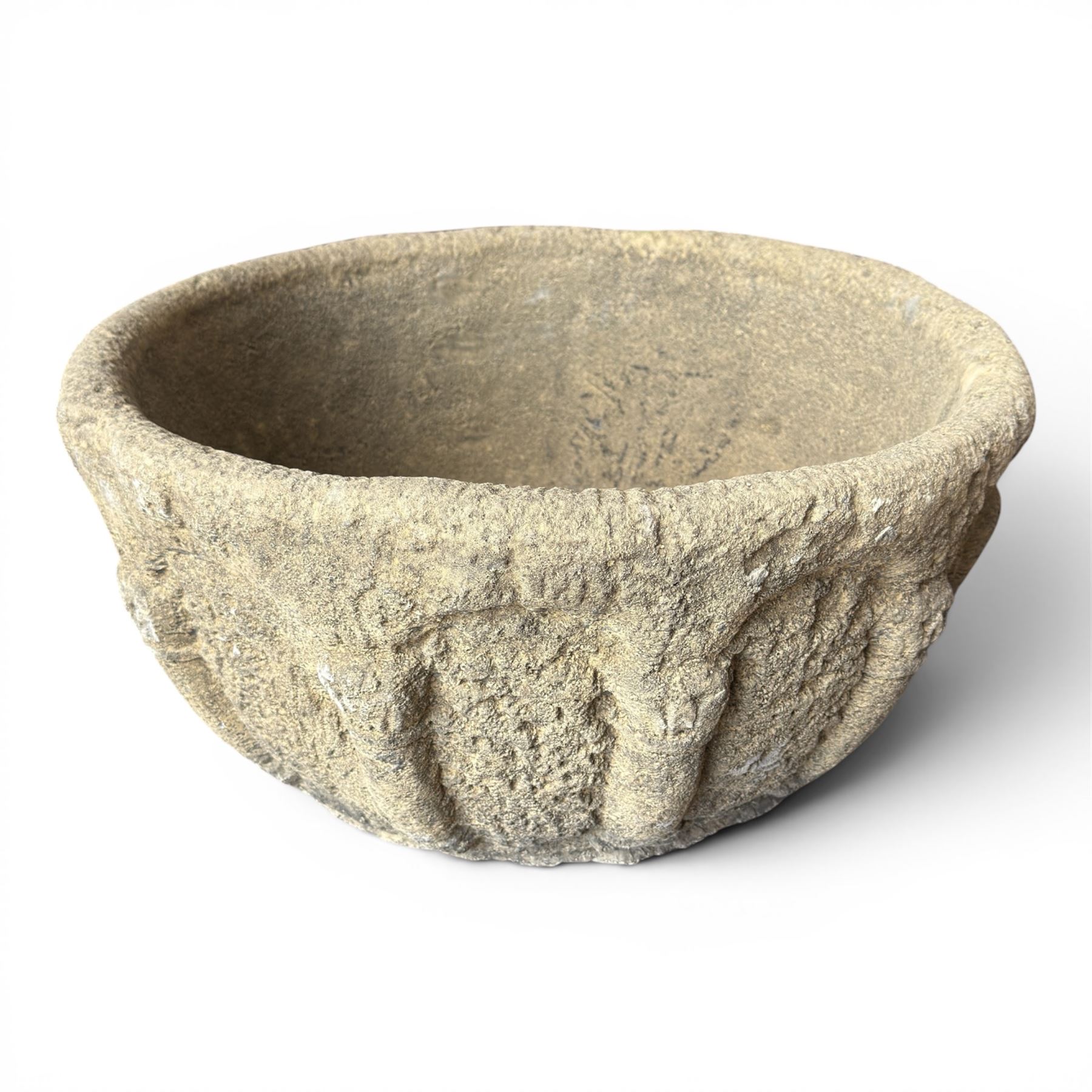 Large cast stone ecclesiastical style urn in the style of a baptismal font, featuring a hand-carved style exterior with Neoclassical columns in relief