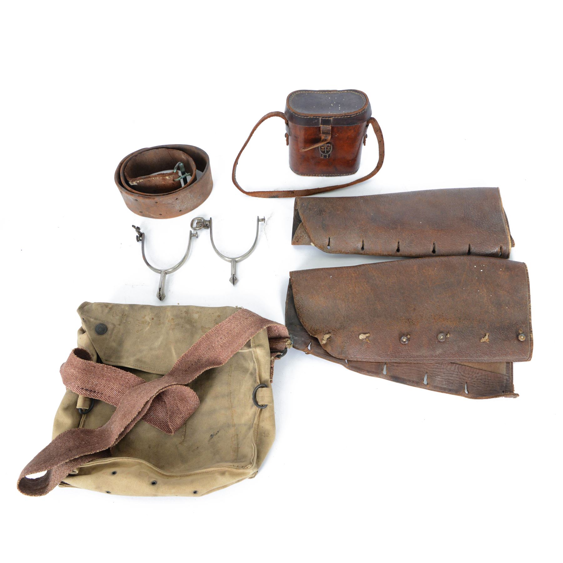 Collection of 20th century military related items, including leather gaiters, field binoculars, canvas bag, spurs 