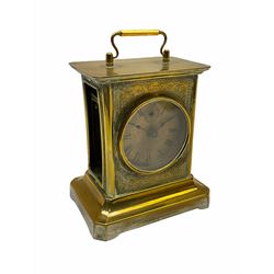 Late 19th century German Junghans “Joker “carriage clock with a musical alarm, engraved rectangular dial plate, circular card dial within an integral glazed bezel, roman numerals, minute track and alarm dial, steel spade hands, glass side panels (one missing) and rear case door, thirty-hour spring driven movement, pin pallet balance escapement, rear wound and set. 
With key.
