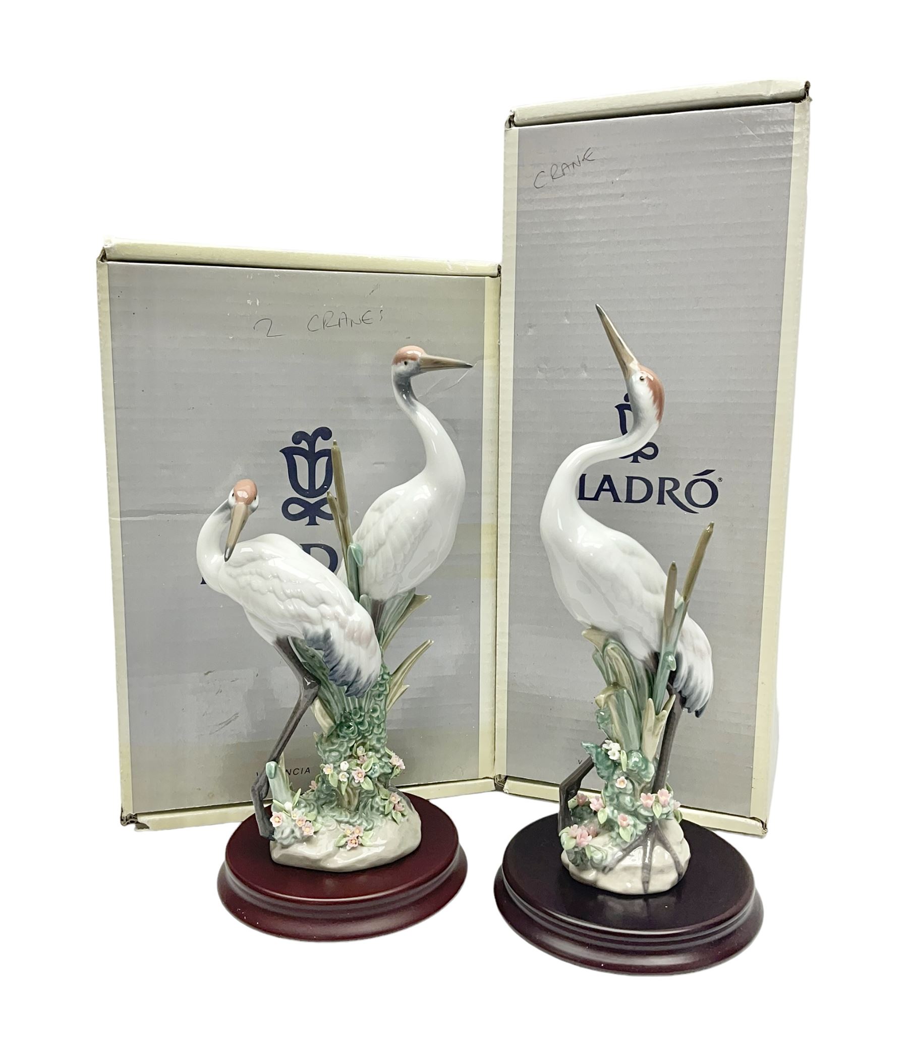 Two boxed Lladro figures, comprising courting cranes no 1611 and dancing crane no 1614, both with original boxes 