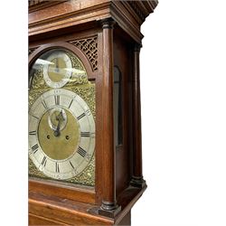 Henry Hindley of York – mid-18th century oak cased 8-day longcase clock,
flat topped caddy pediment with gesso finials, rectangular hood door flanked by wooden turned pilasters with capitals, canted trunk with a full-length break arch topped door on a short plinth with applied skirting and bracket feet, brass dial with a silvered chapter ring, Roman numerals and five-minute Arabic’s, minute and inner quarter hour tracks, matted dial centre with subsidiary seconds dial, blued steel hands and female head pattern spandrels, silvered calendar dial to the break arch with dolphin spandrels, four pillar rack striking movement, striking the hours on a bell. With weights and pendulum. 
H250 W48 D27
Henry Hindley originally from Wigan (Lancs) is recorded as working in York from Petergate 1731-41 then Stonegate 1741-1771. A famous and highly innovative maker, often referred to as the “Tompion of the North.” 
