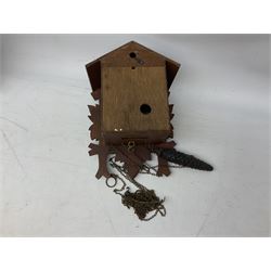 Three 20th century cuckoo clocks and weights for parts or repair.

