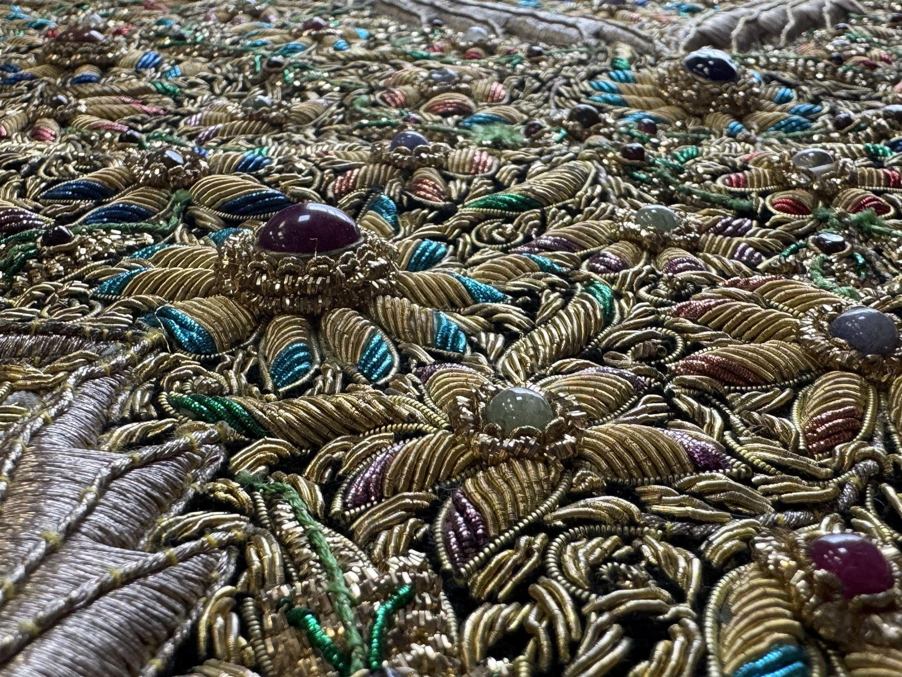 20th century large Zardozi wall hanging, hand embroidered in gold thread on black velvet ground with semi-precious stones and central medallion  149x93cm