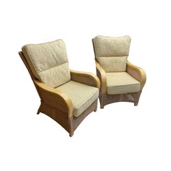 Contemporary rattan conservatory suite - two seat sofa with wicker frame and loose cushions upholstered in textured champagne fabric (W125cm H98cm); pair of matching armchairs (W72cm H98cm); rectangular glass-topped coffee table with rattan frame and undertier (W85cm D60cm H47cm); and matching square side table (W53cm H55cm)