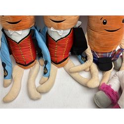 Three large ALDI Kevin carrots and giant unicorn stuffed toy together with quantity of smaller carrots
