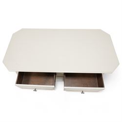 Light grey painted low coffee table, canted rectangular form fitted with two through drawers, on compressed bun feet