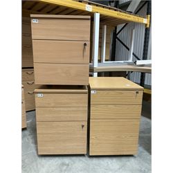 Pair of beech and single oak effect filing pedestals on castors. - THIS LOT IS TO BE COLLECTED BY APPOINTMENT FROM DUGGLEBY STORAGE, GREAT HILL, EASTFIELD, SCARBOROUGH, YO11 3TX
