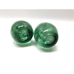 A pair of Victorian green glass dump paperweights, with internal foil flower decoration, H12.5cm. 