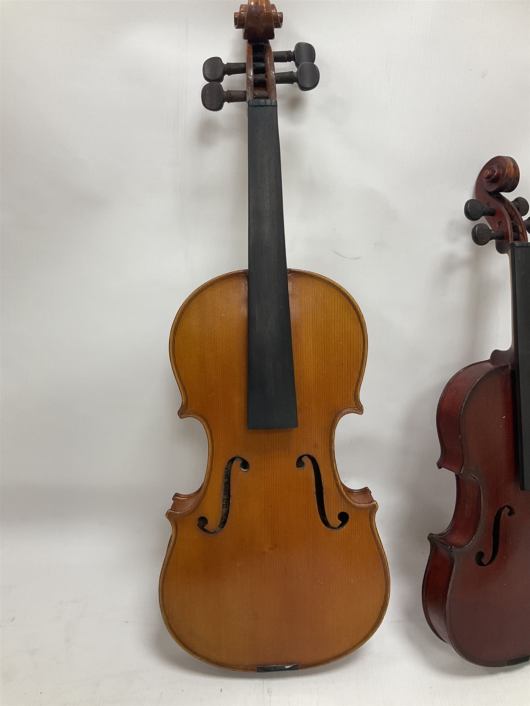 Four violins 1/8th size; half size with Nicolas Bertholini label; three-quarter size with Stradivarius copy label; and full size with Marquis De L'Air label (4)