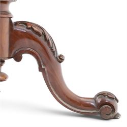 Two Victorian mahogany pole screens, comprising an oval example with floral needlework panel and carved cresting, on brass pole and tripod base with scroll carved supports (H 153cm, W 43cm, D 43cm); and a rectangular example with glazed architectural print panel, on brass pole, turned column and conforming scroll carved tripod base (H 147cm, W 38cm, D 38cm)
