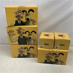 A group of six Coalport Wallace & Gromit figurines, comprising 'Hold on Gromit' no880/2000 with certificate, 'Decorating in Techno Trousers' no1195/2000 with certificate, 'Reading for Take Off', 'Do something Gromit', 'Feathers in disguise', 'Happy Birthday Gromit', each in maker's box with accompanying swing tag.