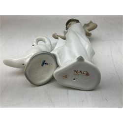 Quantity of figures to include Lladro example modelled as swan together with three Nao figures to include two April Showers no 1126, two with boxes 