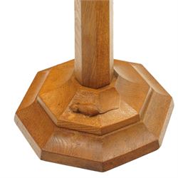 Mouseman - oak standard lamp, the turned octagonal column terminating to a stepped cavetto octagonal base, with carved mouse signature, by the workshop of Robert Thompson of Kilburn
