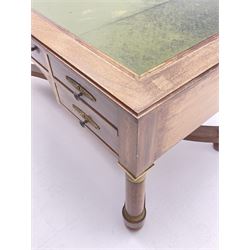 French Empire style walnut desk, moulded rectangular top with inset leather, two leather inset slides either side, fitted with four drawers, turned supports joined by curved x-shaped stretchers, gilt metal mounts 