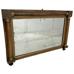 Early 19th century rosewood overmantel mirror, rectangular form with turned half pilasters, moulded gilt slip enclosing plain mirror plate, on turned feet