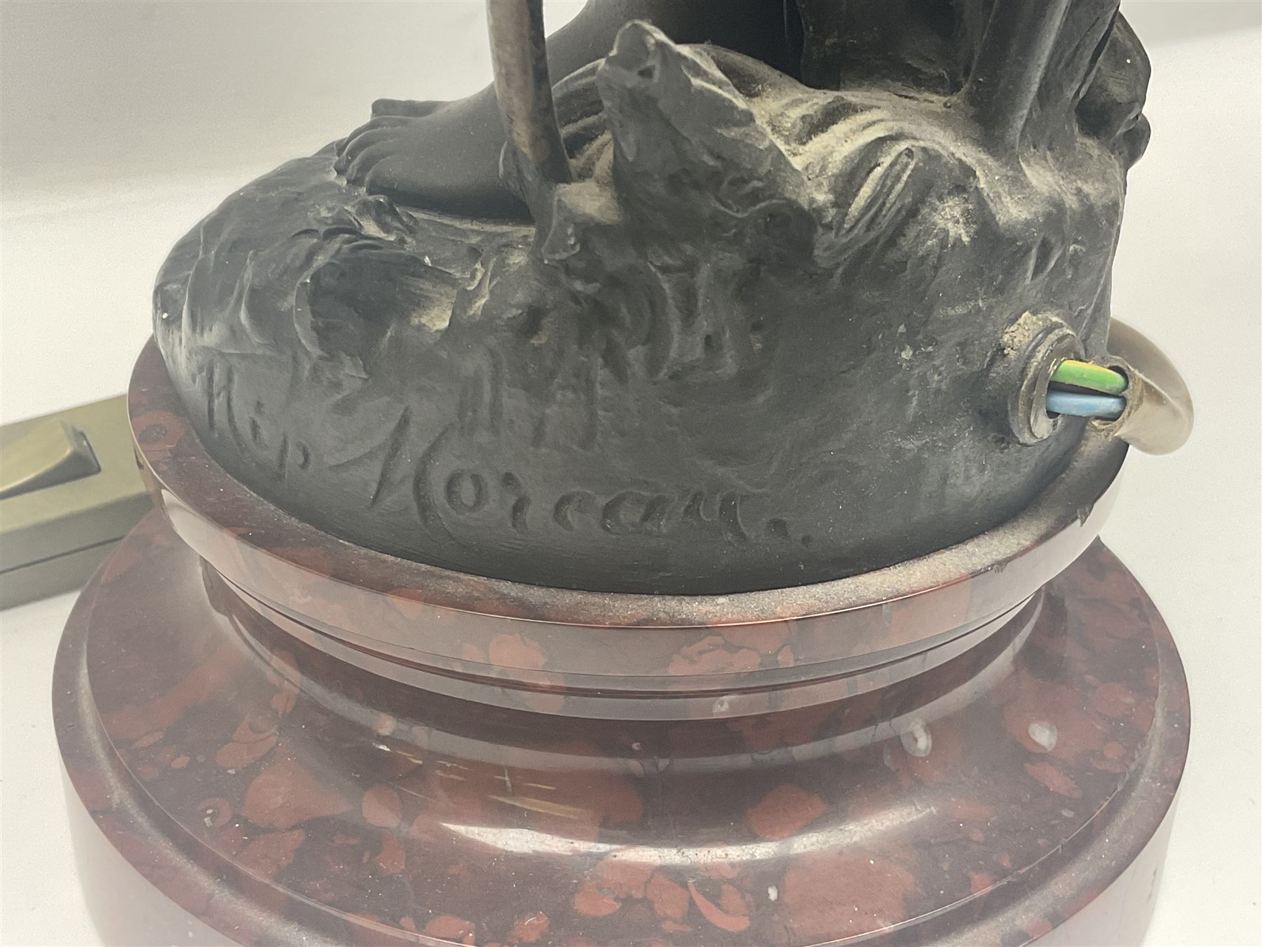 Pair of Art Nouveau style spelter figural table lamps, each mounted on rouge marble effect circular bases, with toleware flower heads and leafy decoration surrounding a female figure, H90cm