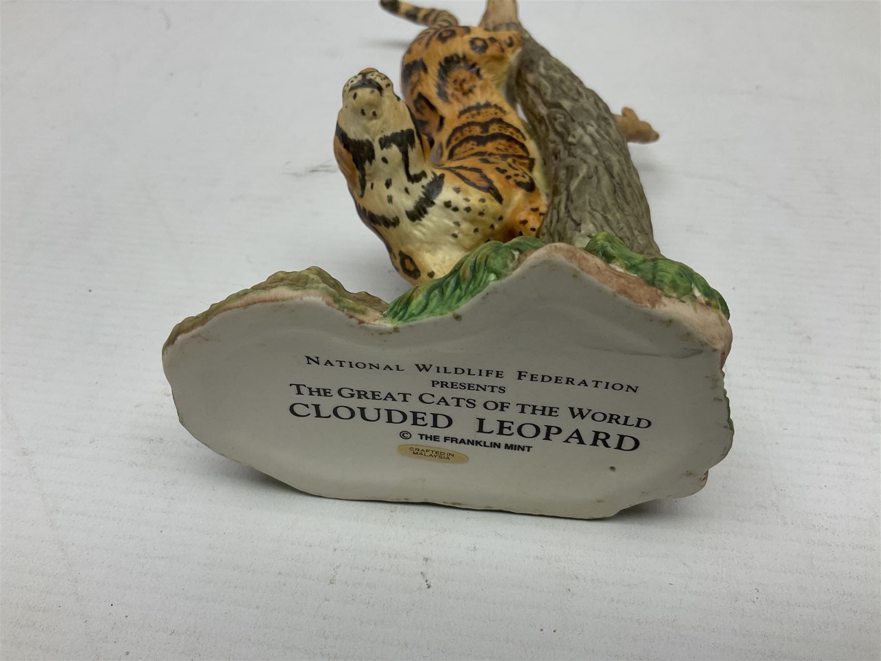 Ten Franklin Mint National wildlife Foundation Big Cats of the World figures to include, White Bengal Tiger, Jaguar, Cougar, Cheetah, Clouded Leopard etc, with display stand