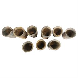 Nine lava stone iron smelting crucible pots in various conditions