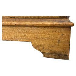 Late Victorian walnut triple combination wardrobe, projecting moulded and dentil cornice, central shaped bevelled mirror glazed door, cartouche and curled leaf carved panels over figured walnut veneered panels, fitted with drawer to base, on bracket feet