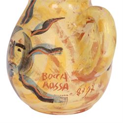 Vallauris French pottery by Patrick Bocca Rossa, jug painted with sun motifs upon a yellow ground, and an octagonal plate with a face to the center, both signed, jug H22cm 