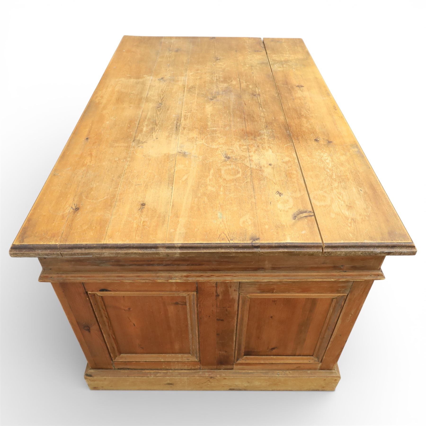 Late 19th century Victorian pine twin pedestal desk, rectangular plank top above an arrangement of seven drawers with brass swan neck handles, each pedestal fitted with one drawer above a double height drawer, raised on plinth bases with panelled sides